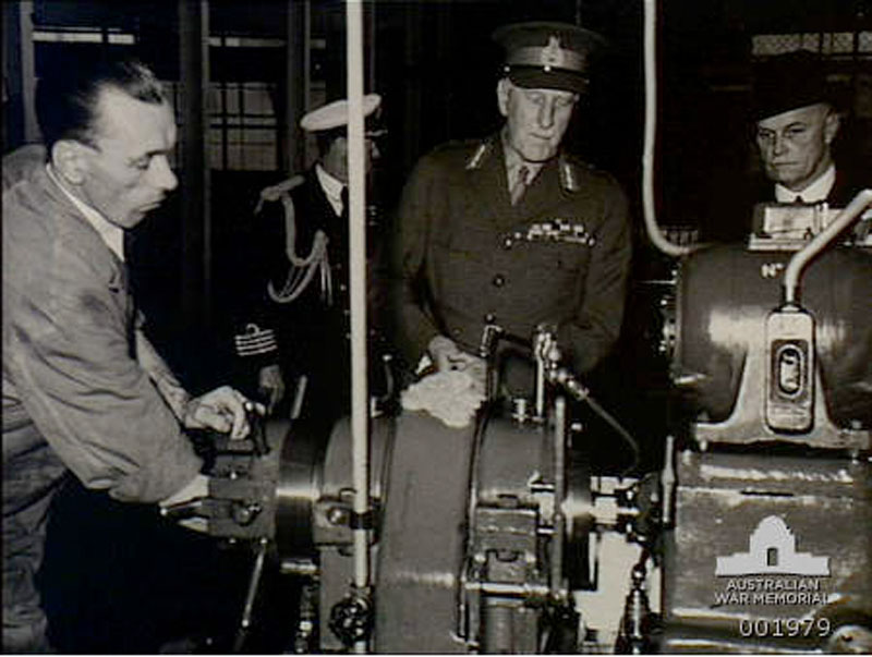 Governor General Lord Gowrie being shown how 18lb bomb shell cases are made 1940
